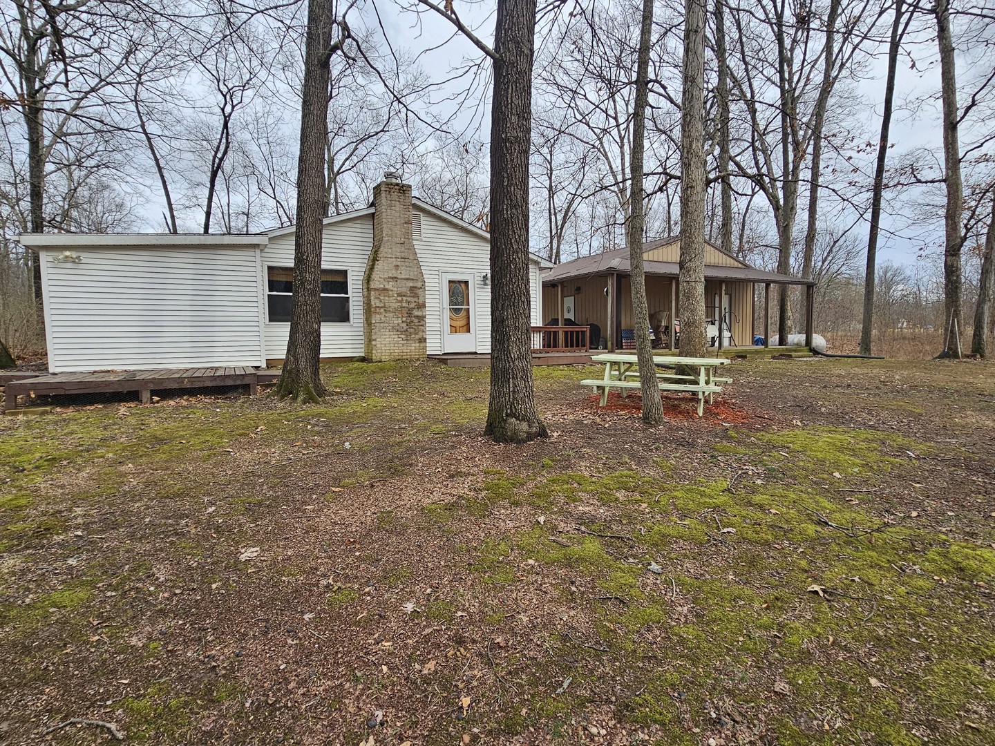 13751 North Condor Lane Bluford, IL 62814 - Photo 16 of 38 a backyard of a house with table and chairs