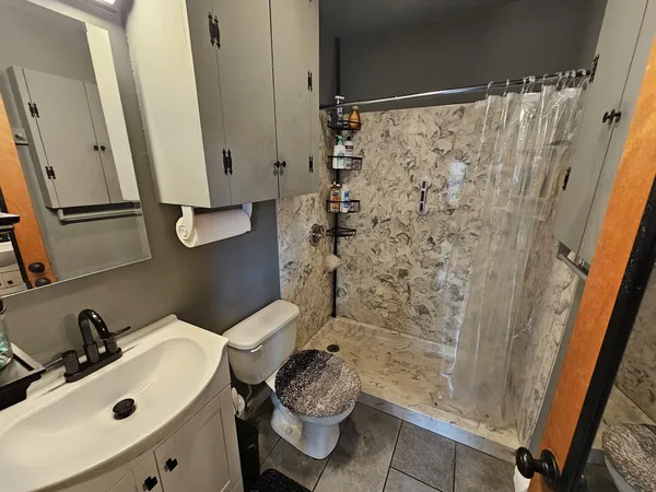 a bathroom with a sink and a mirror