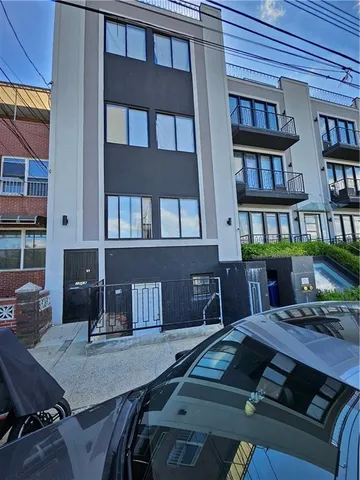 a view of a dining room with furniture and a book shelf