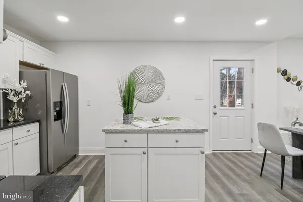 a view of entryway with wooden floor