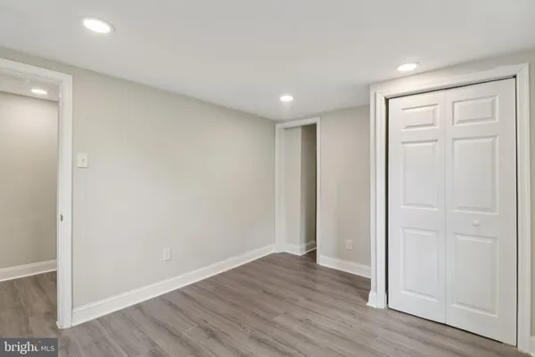 a bathroom with a sink mirror and vanity