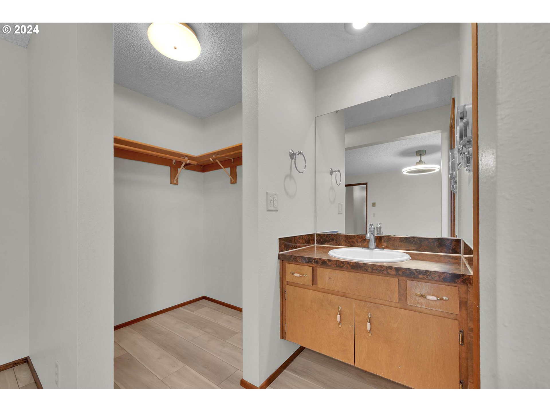 5215 G Street Springfield, OR 97478 - Photo 16 of 35 a bathroom with a granite countertop sink a mirror and a vanity