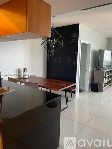 a living room with a table and chairs