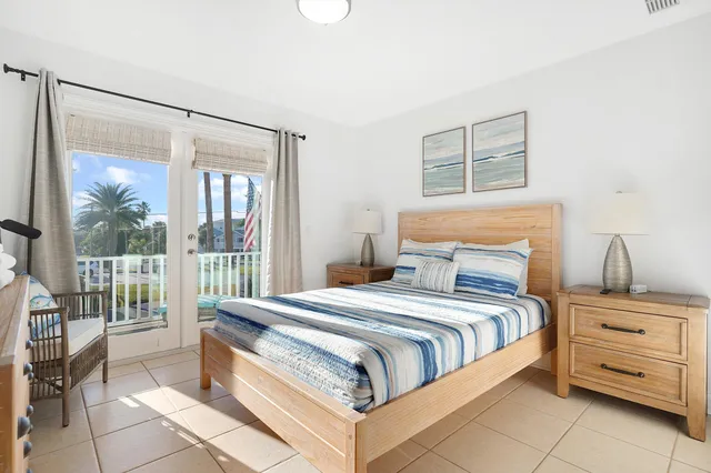 a view of a balcony with chair and potted plants
