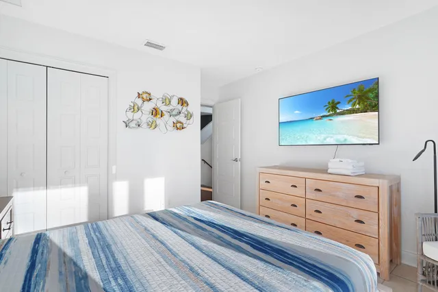 a view of a balcony with chairs and wooden floor