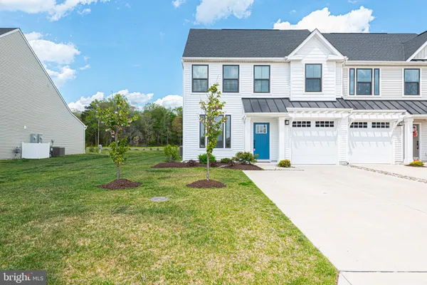a front view of a house with yard