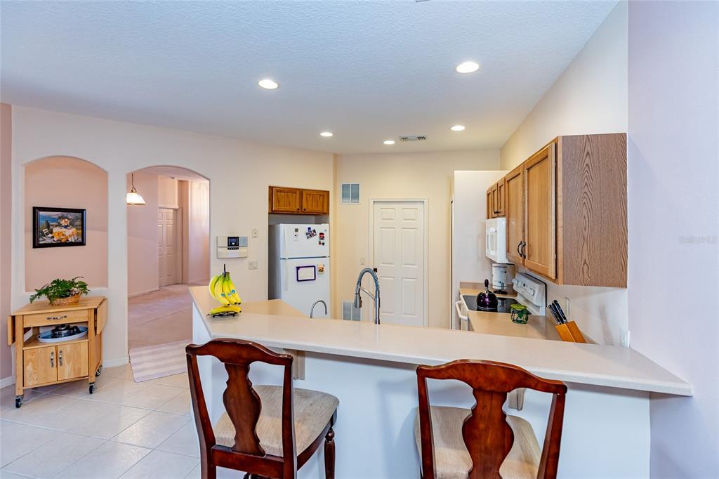 15788 Southwest 11th Terrace Road Ocala, FL 34473 - Photo 13 of 59 a kitchen with stainless steel appliances a sink and a refrigerator