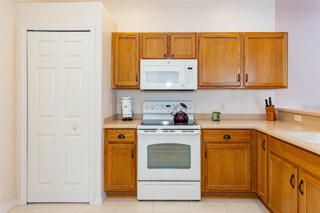 15788 Southwest 11th Terrace Road Ocala, FL 34473 - Photo 14 of 59 a kitchen with a stove sink and cabinets