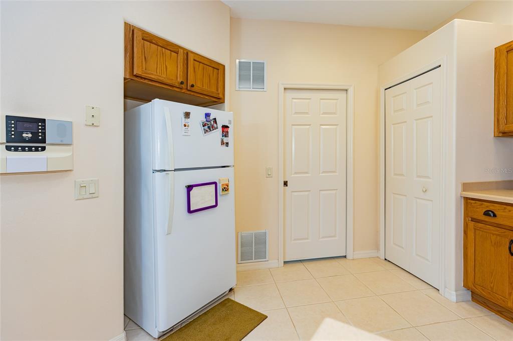 15788 Southwest 11th Terrace Road Ocala, FL 34473 - Photo 16 of 59 a white refrigerator freezer sitting inside of a kitchen