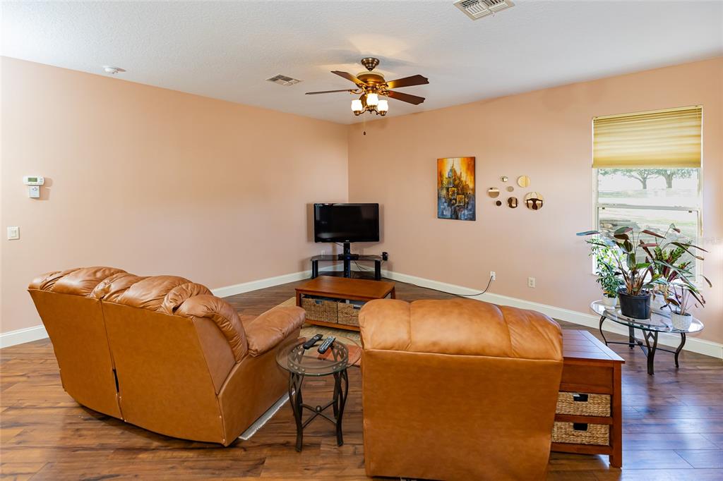 15788 Southwest 11th Terrace Road Ocala, FL 34473 - Photo 18 of 59 a room with furniture and wooden floor