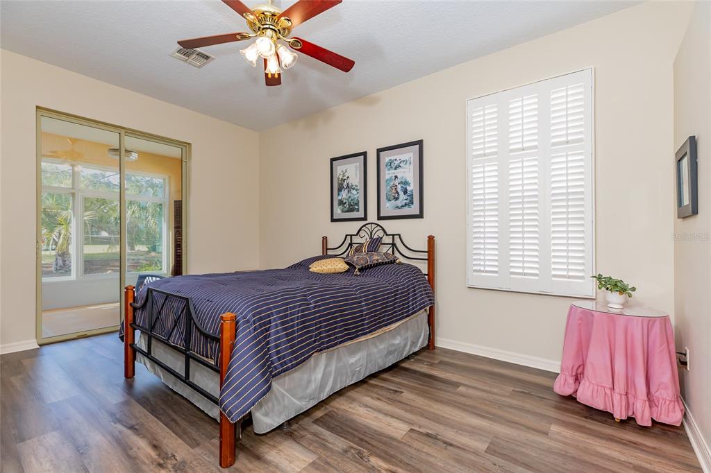 15788 Southwest 11th Terrace Road Ocala, FL 34473 - Photo 20 of 59 a bed sitting in a bedroom next to a window