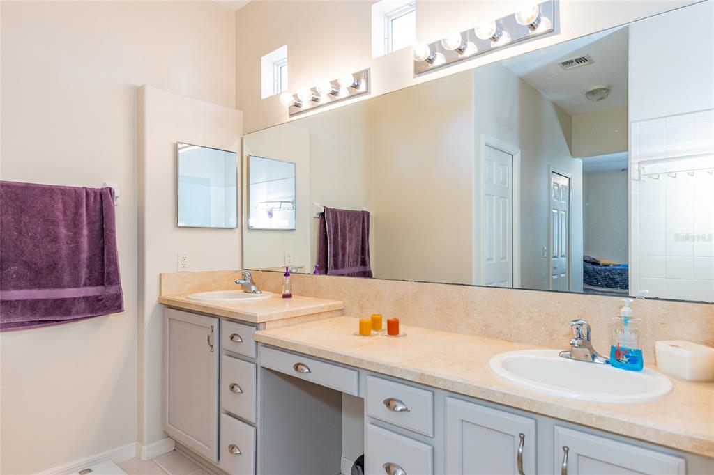 15788 Southwest 11th Terrace Road Ocala, FL 34473 - Photo 25 of 59 a bathroom with a sink double vanity granite and a mirror