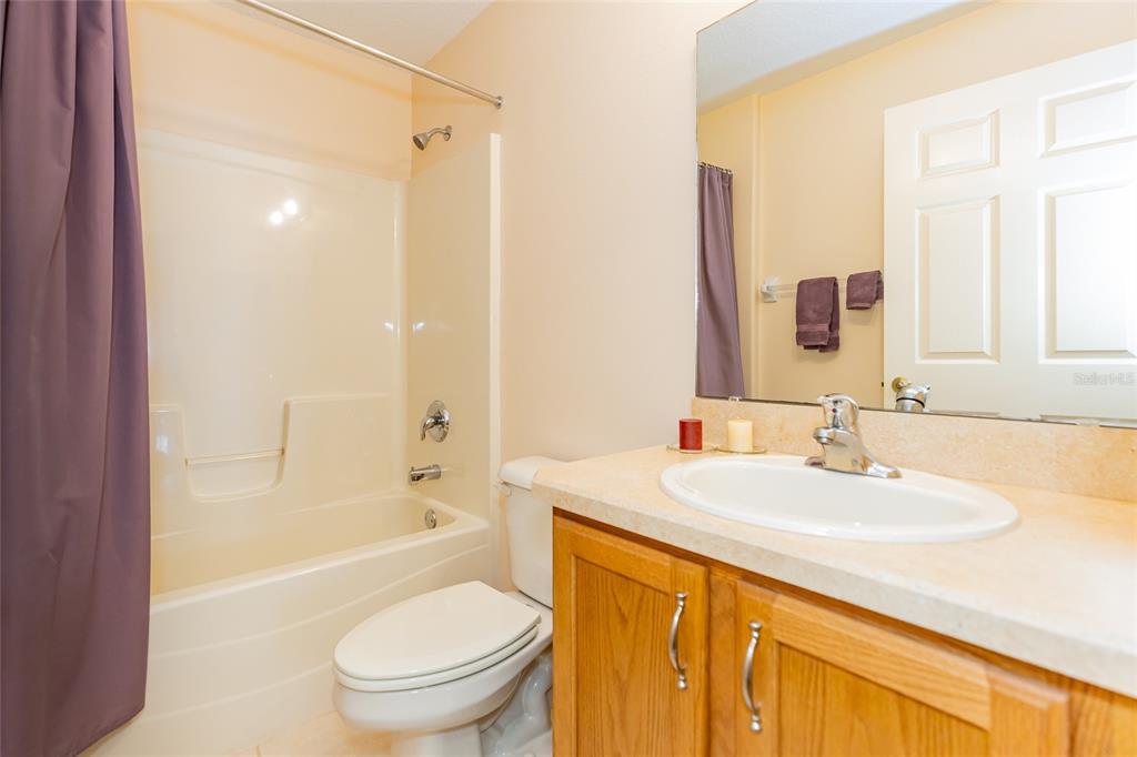 15788 Southwest 11th Terrace Road Ocala, FL 34473 - Photo 30 of 59 a bathroom with a sink a toilet and shower