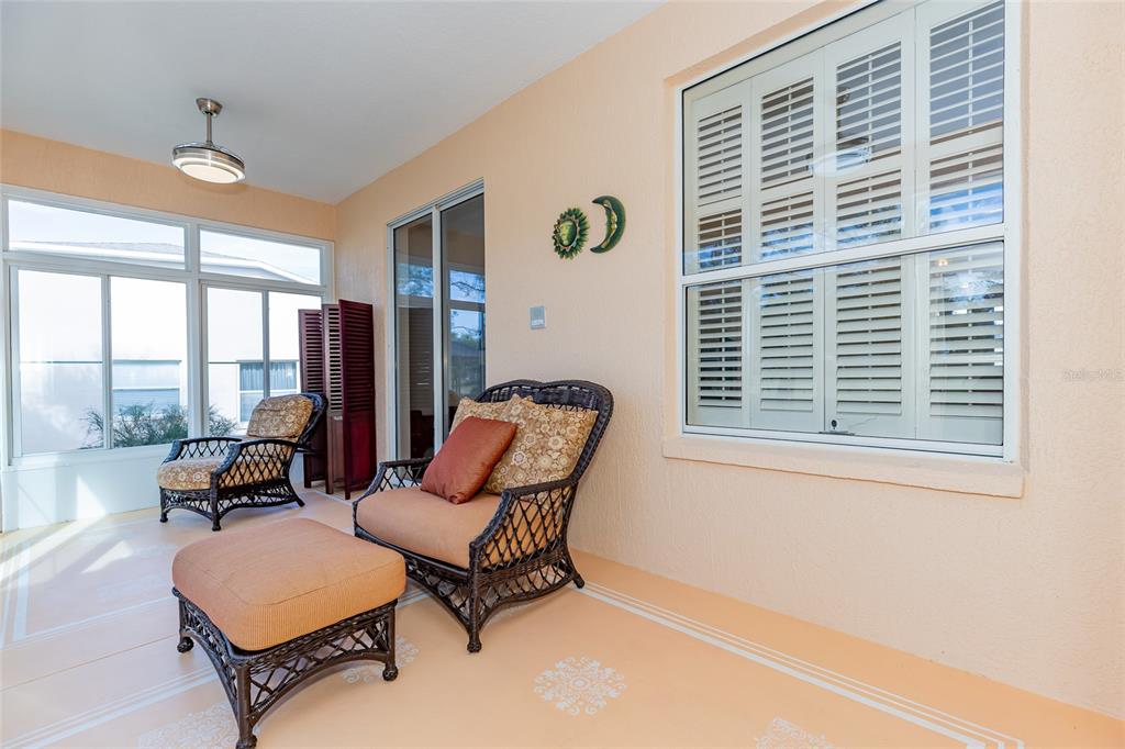 15788 Southwest 11th Terrace Road Ocala, FL 34473 - Photo 34 of 59 a living room with furniture and floor to ceiling windows