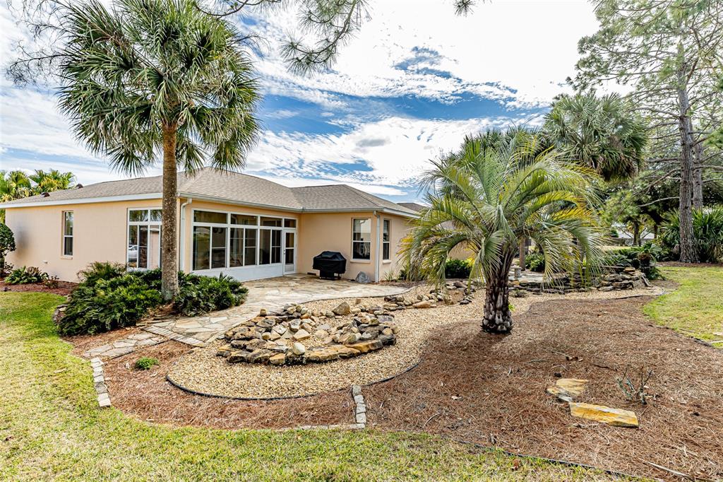 15788 Southwest 11th Terrace Road Ocala, FL 34473 - Photo 38 of 59 a front view of a house with a yard and garage