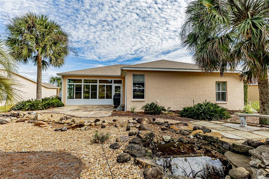 15788 Southwest 11th Terrace Road Ocala, FL 34473 - Photo 40 of 59 a front view of a house with a garden