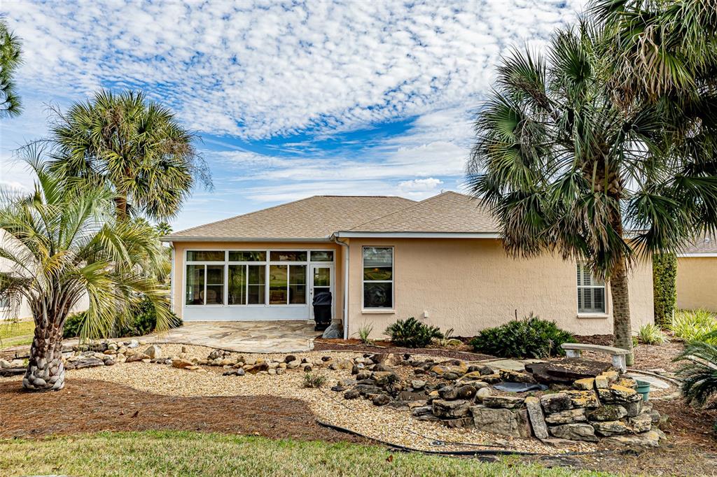15788 Southwest 11th Terrace Road Ocala, FL 34473 - Photo 42 of 59 a view of a house with a patio