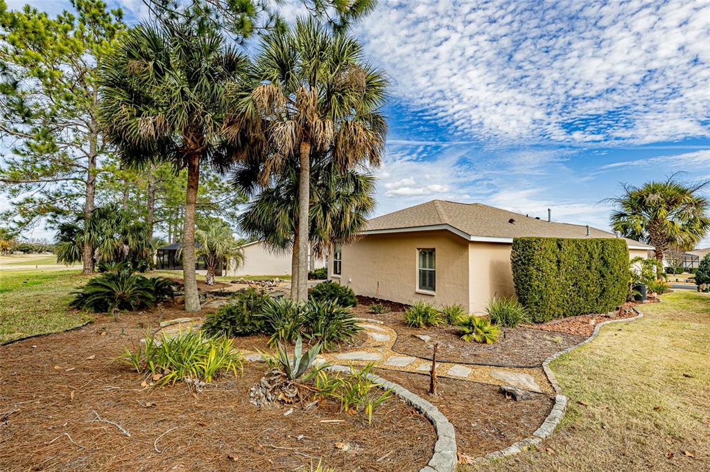 15788 Southwest 11th Terrace Road Ocala, FL 34473 - Photo 43 of 59 a front view of a house with garden