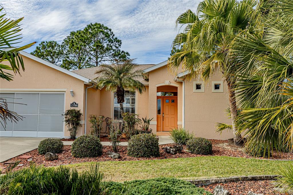 15788 Southwest 11th Terrace Road Ocala, FL 34473 - Photo 5 of 59 a front view of a house with a yard