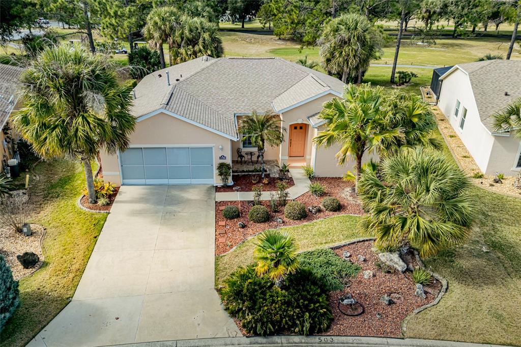 15788 Southwest 11th Terrace Road Ocala, FL 34473 - Photo 57 of 59 an aerial view of a house with swimming pool and large trees