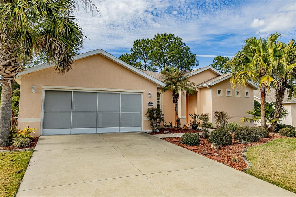 15788 Southwest 11th Terrace Road Ocala, FL 34473 - Photo 6 of 59 a front view of a house with a yard
