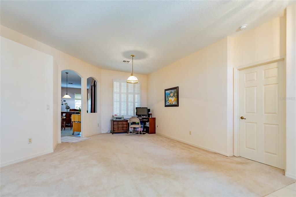 15788 Southwest 11th Terrace Road Ocala, FL 34473 - Photo 10 of 59 an empty room with furniture and a chandelier