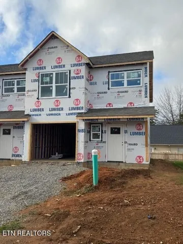 a view of kitchen with cabinets and wooden floor