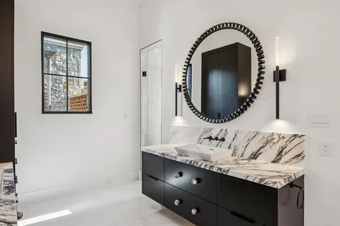 a bathroom with a sink and a mirror