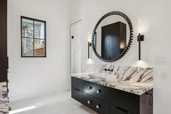 a bathroom with a sink and a mirror
