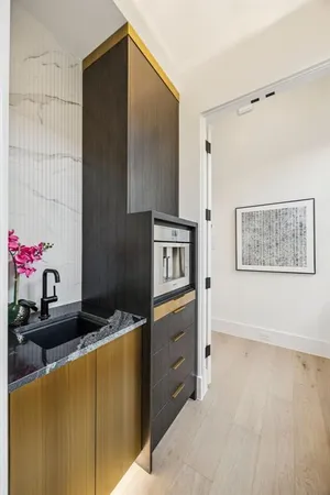 a kitchen with granite countertop cabinets and stainless steel appliances