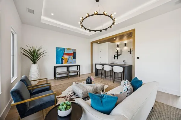 a living room with furniture and a table