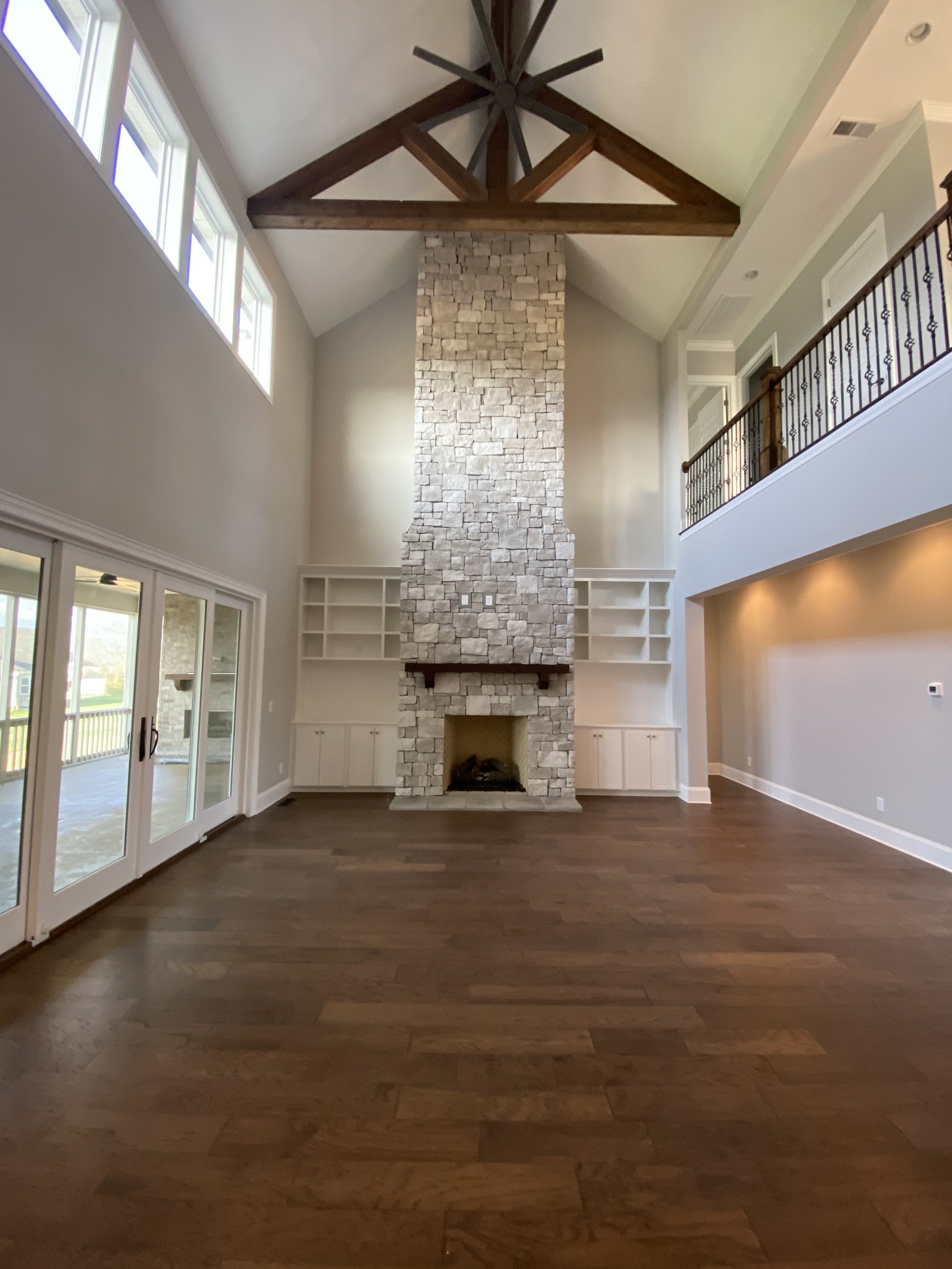 8015 Burning Tree Farms Road Arrington, TN 37014 - Photo 5 of 10 a view of empty room with wooden floor and fireplace