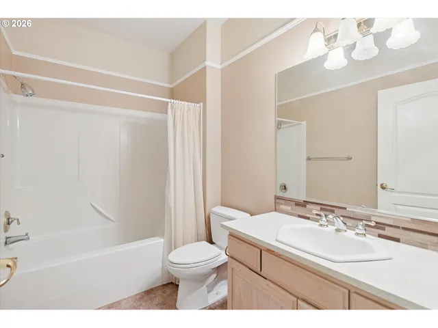 a bathroom with a sink a toilet and a bathtub