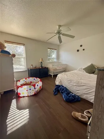 a bedroom with furniture and a window