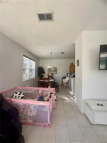 a room with furniture and a flat screen tv