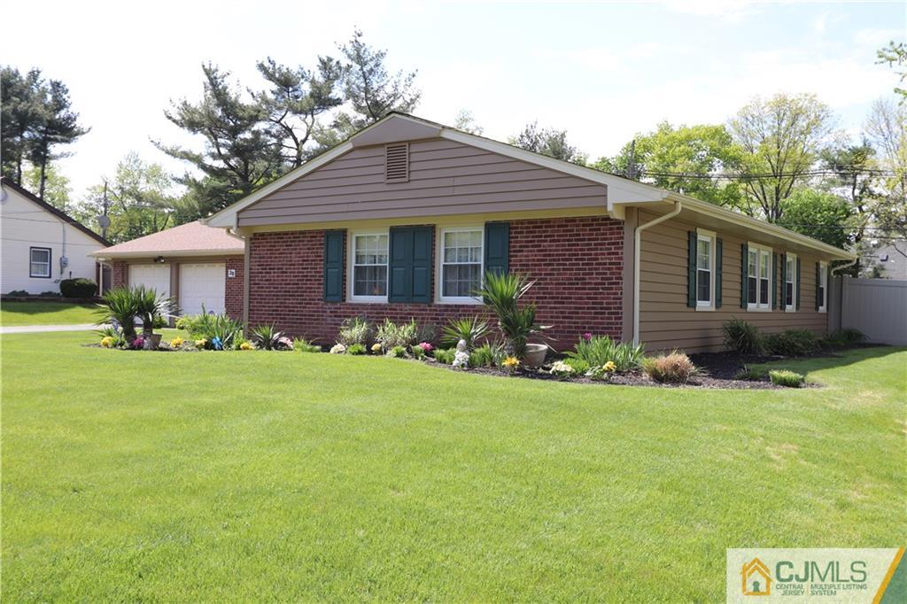 20 Flower Road Somerset, NJ 08873 - Photo 3 of 25 a front view of a house with a yard and porch