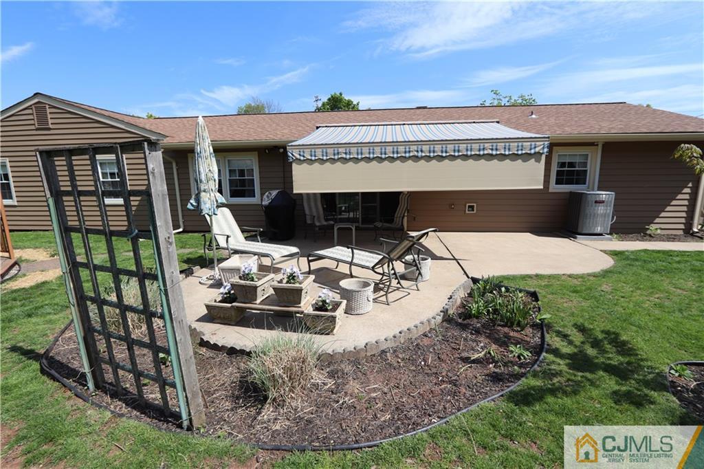 20 Flower Road Somerset, NJ 08873 - Photo 22 of 25 a view of a house with backyard and sitting area