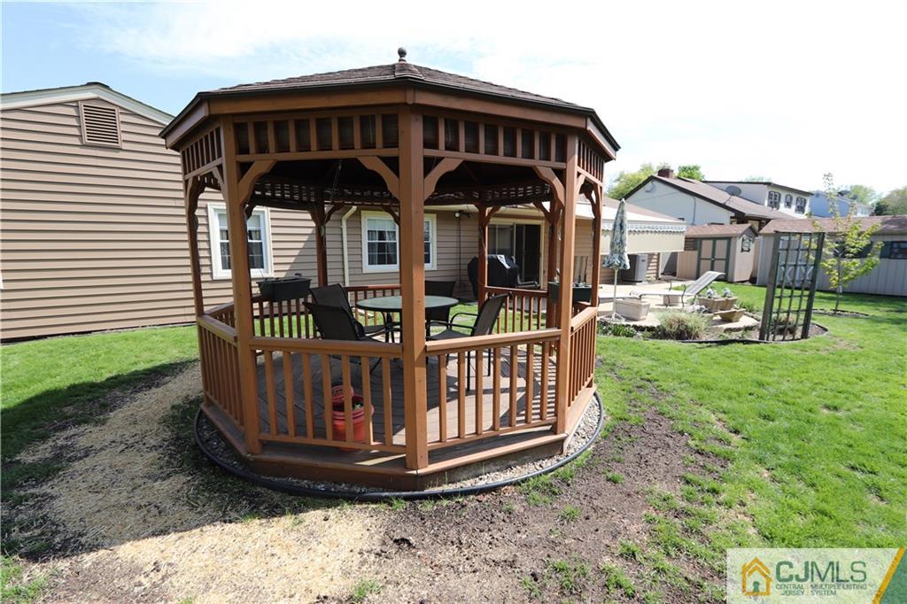 20 Flower Road Somerset, NJ 08873 - Photo 23 of 25 a view of a wooden house with a yard