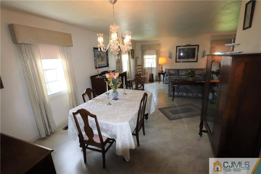 20 Flower Road Somerset, NJ 08873 - Photo 6 of 25 a view of a dining room with furniture and a chandelier