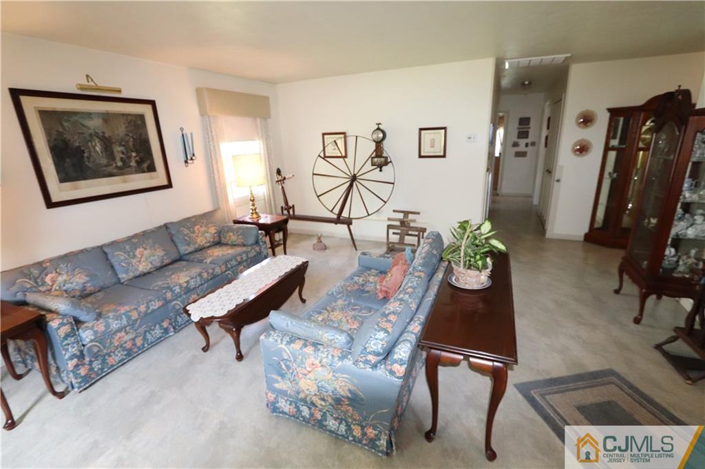 20 Flower Road Somerset, NJ 08873 - Photo 7 of 25 a living room with furniture and wooden floor
