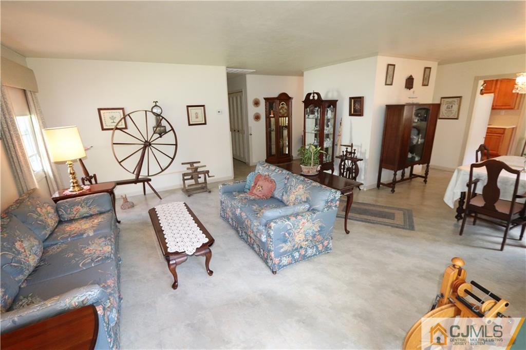 20 Flower Road Somerset, NJ 08873 - Photo 8 of 25 a living room with furniture and wooden floor