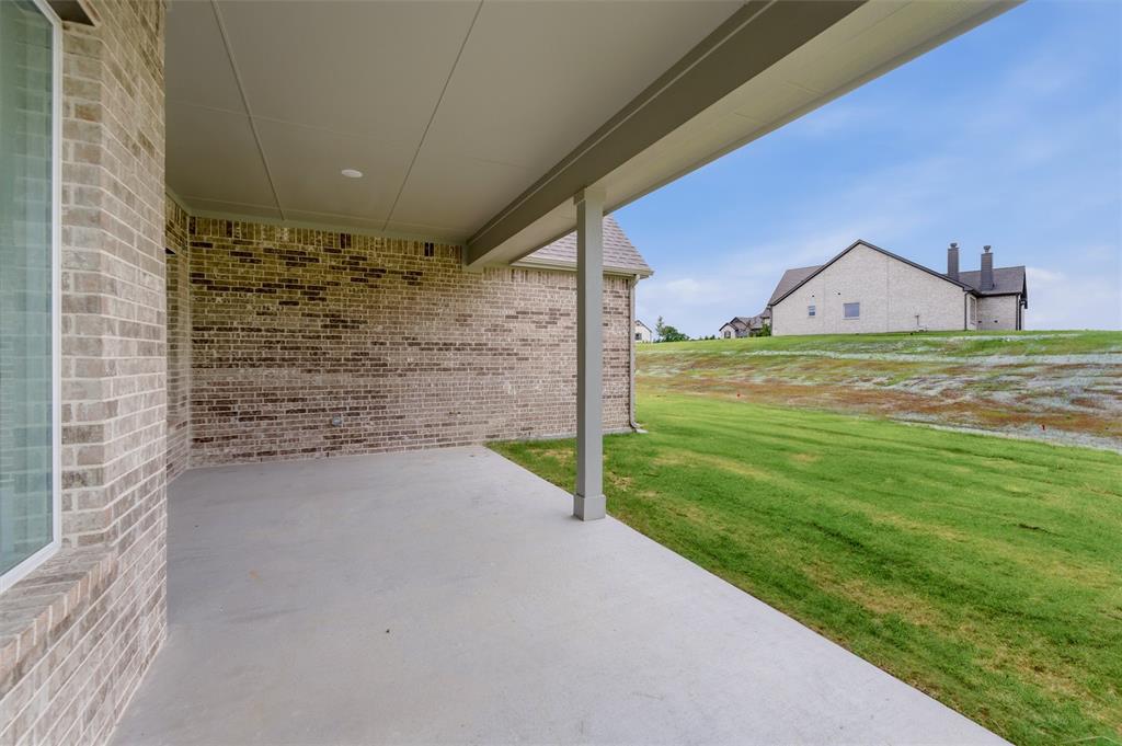 906 Perrin Lane Van Alstyne, TX 75495 - Photo 25 of 30 a view of a house with a yard and garage
