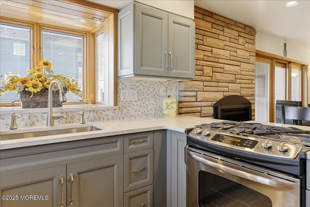 a kitchen with a stove and a sink