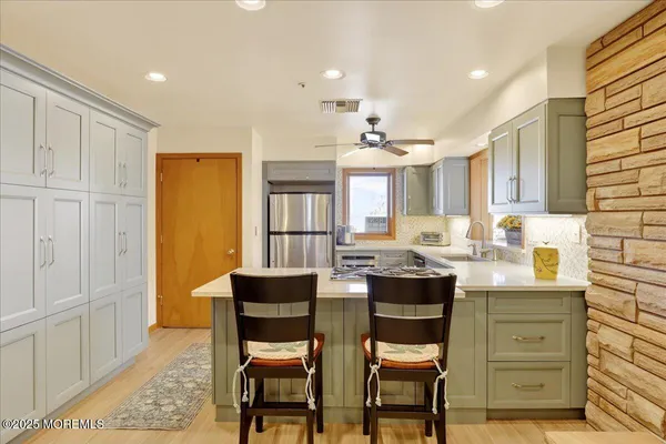 a view of a dining room with furniture and window
