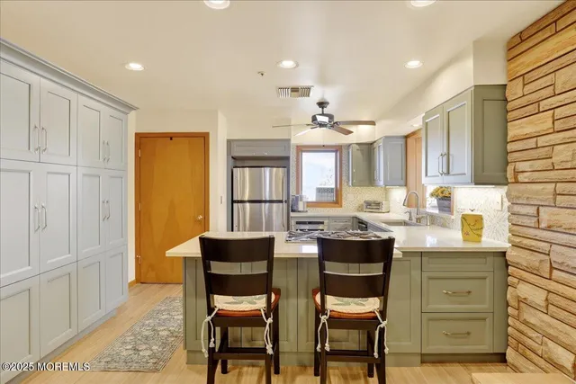 a view of a dining room with furniture and window