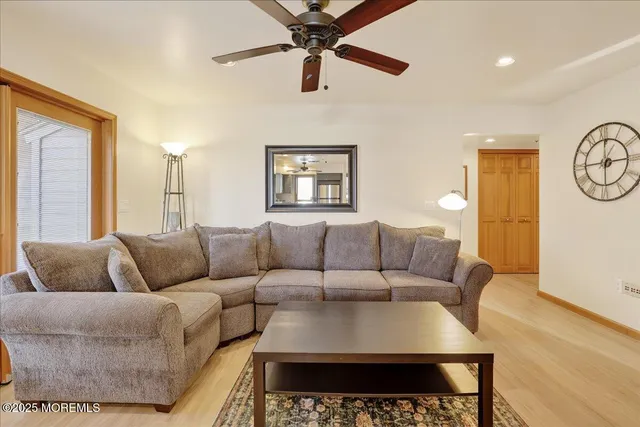 a living room with furniture rug and window