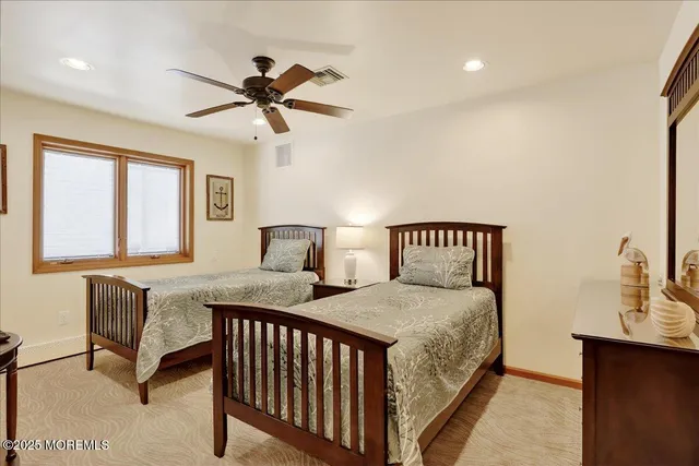 a bedroom with a bed and a table