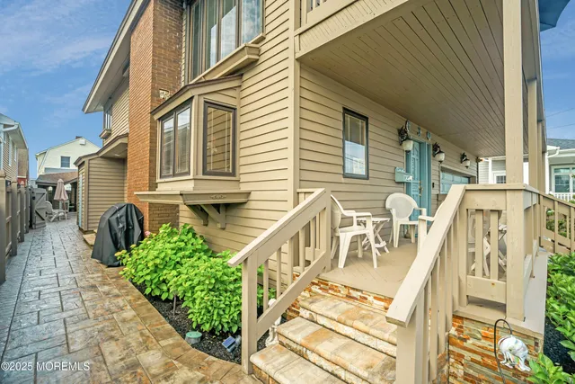 a view of a house with wooden deck