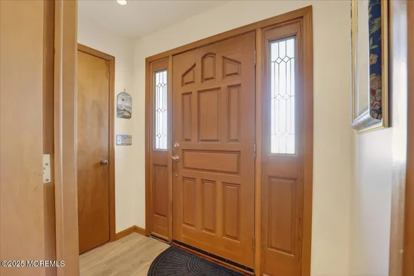 a view of a hallway with front door