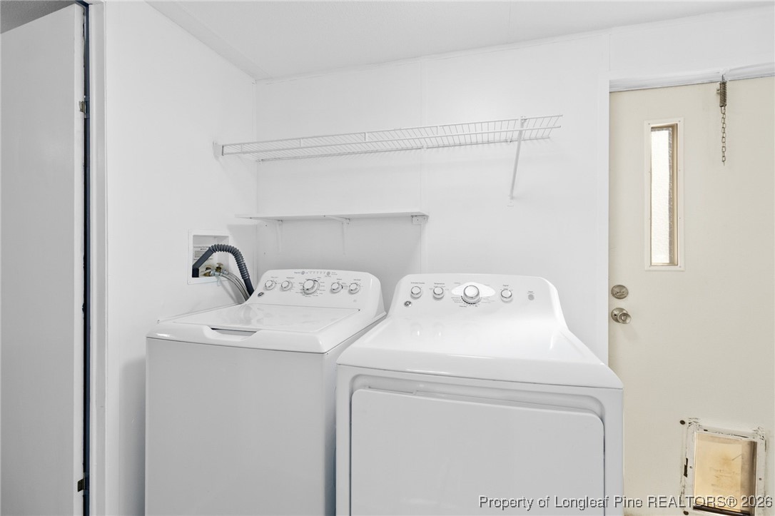 7321 Sheriff Watson Road Sanford, NC 27332 - Photo 12 of 26 a utility room with dryer and washer